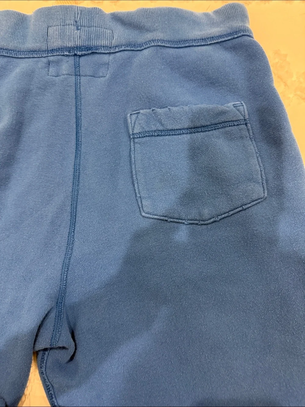 Holister draw waist fleece pants with 2 side pockets & 1 back pocket; blue